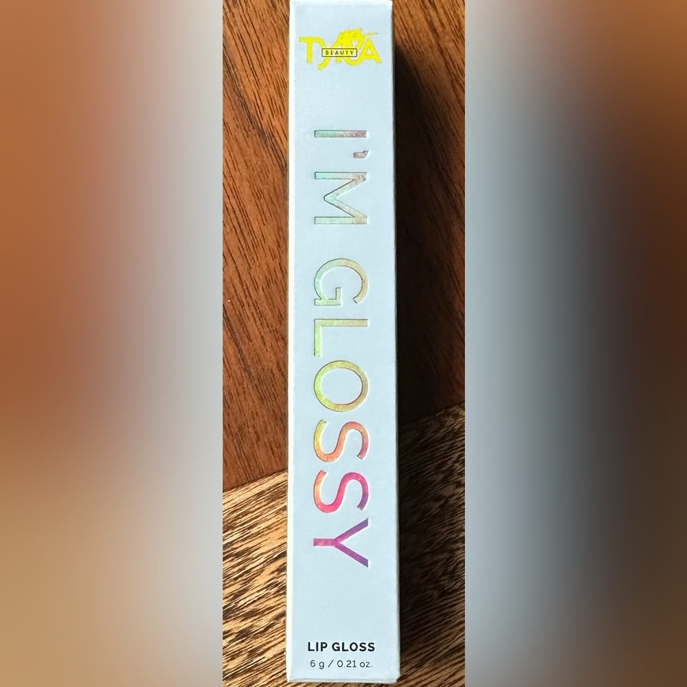 Tyra Beauty I’m Glossy Lip Gloss in We’re Here, We’re Sheer! (Sheer Apricot)